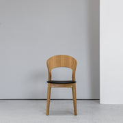 Hans K Rainbow Dining Chair Oak with black leather seat at EDITO