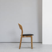 Hans K Rainbow Dining Chair Oak with black leather seat at EDITO