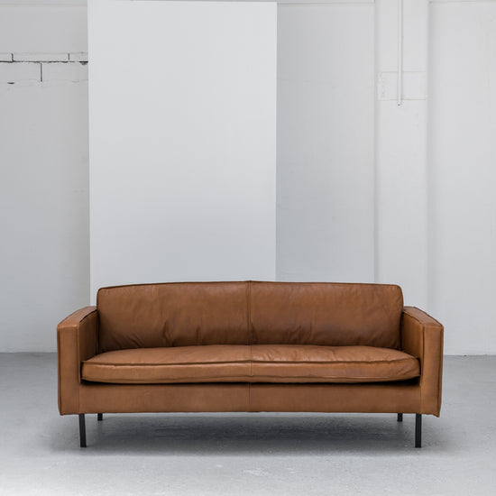 industrial tan leather sofa with black legs at EDITO Furniture