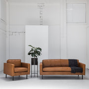 industrial tan leather sofa and armchair with black legs at EDITO Furniture