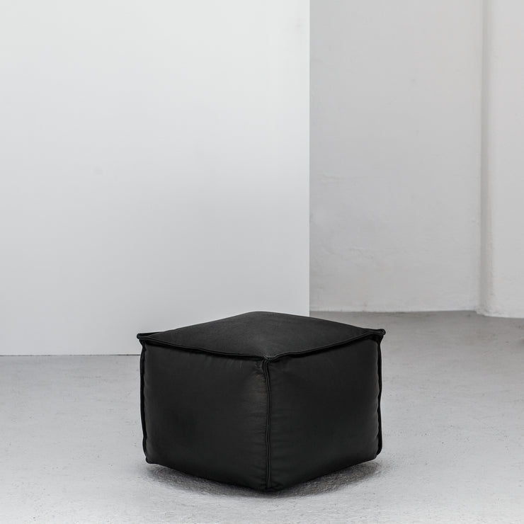 small black leather Ottoman at EDITO Furniture